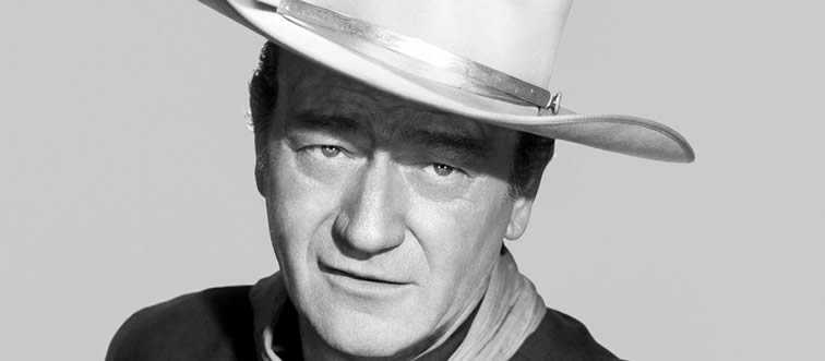Which legendary movie star famously took the lead role in 142 different feature films?